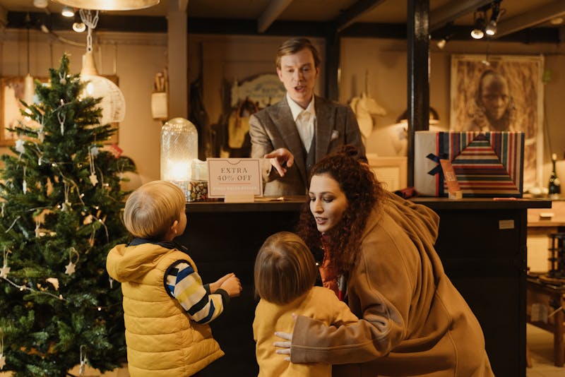 a mom with his sons in a shop